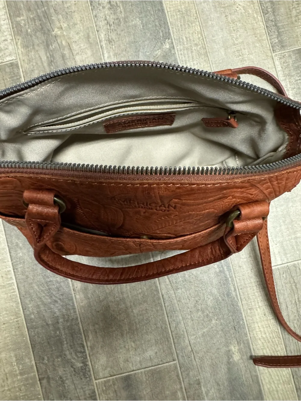 American Leather Co. compact embossed